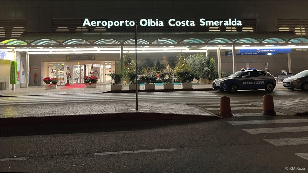Photo of Olbia, Sardinia Airport, front of terminal, at night.