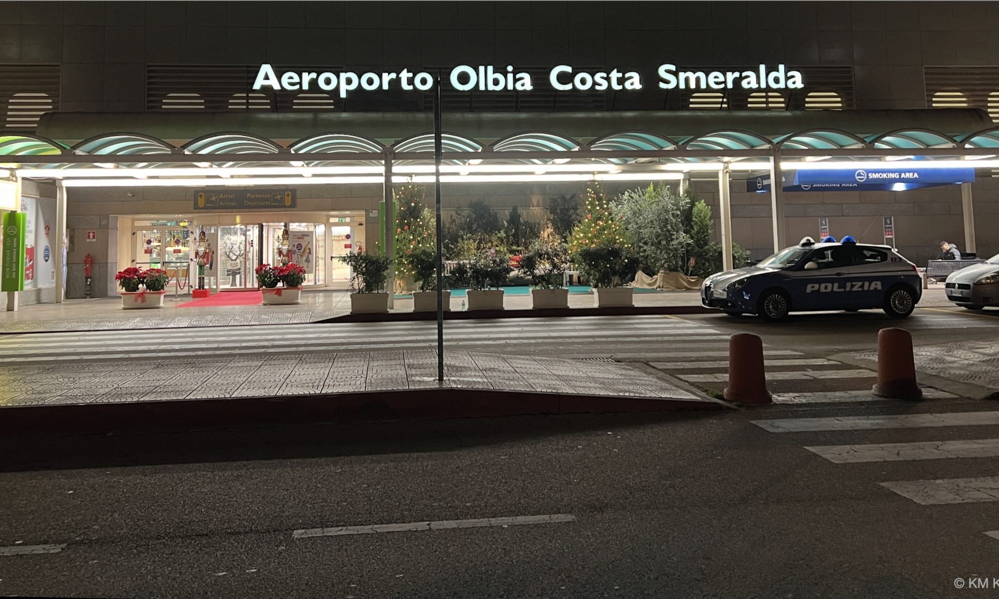 Photo of Olbia, Sardinia Airport, front of terminal, at night.
